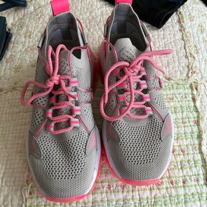 Women’s pink and white sneakers